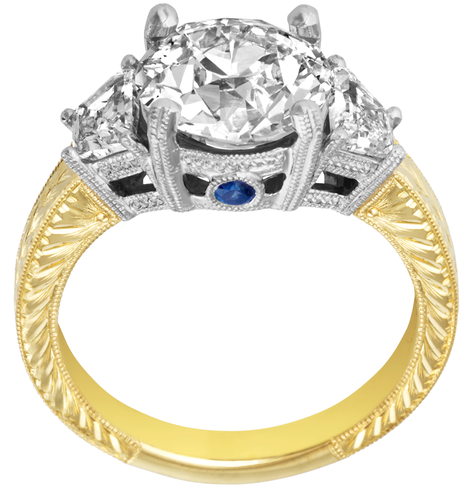 Custom diamond ring design with sapphire accents in engraved two-tone gold. Custom designed by Ron George Jewelers in Annapolis, MD.