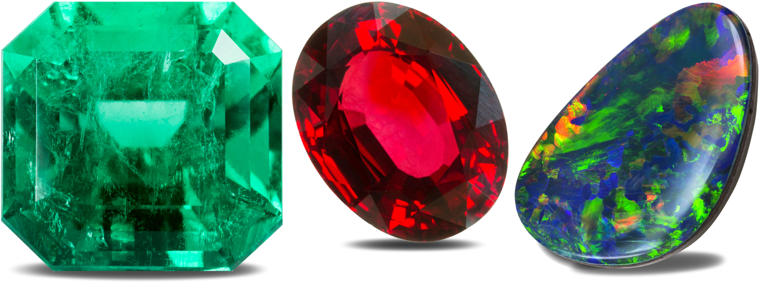 Colorful gemstones including emerald, ruby and opal.