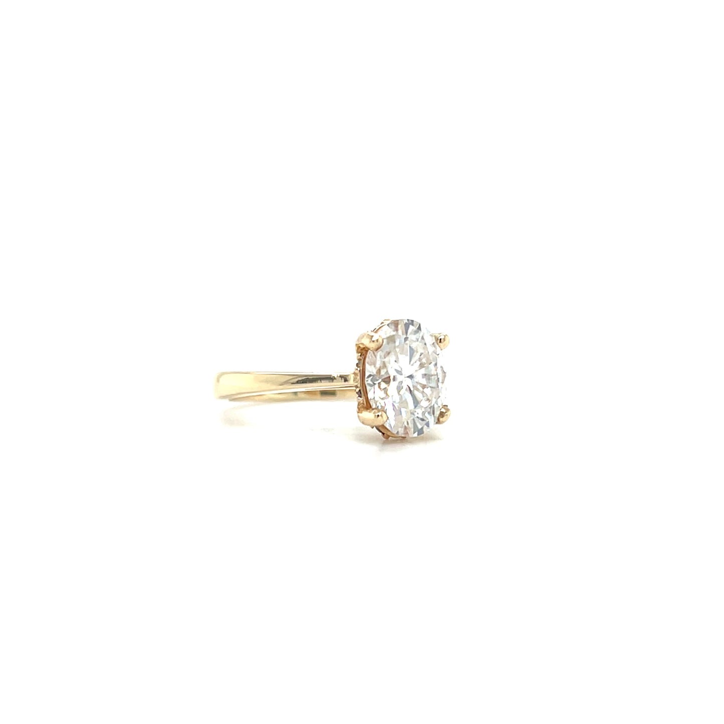 Oval Moissanite Ring with Hidden Halo in 14K Yellow Gold. Left Side View.