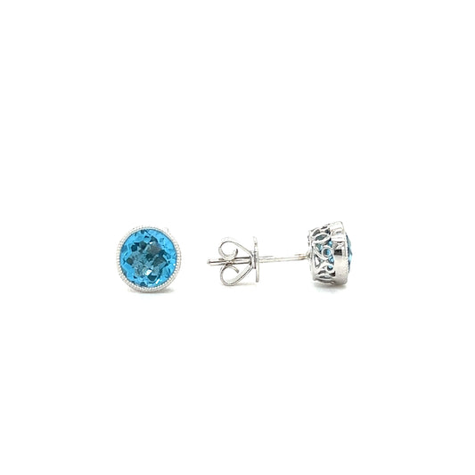 Blue Topaz Stud Earrings with Filigree and Milgrain Details in 14K White Gold Front and Side View