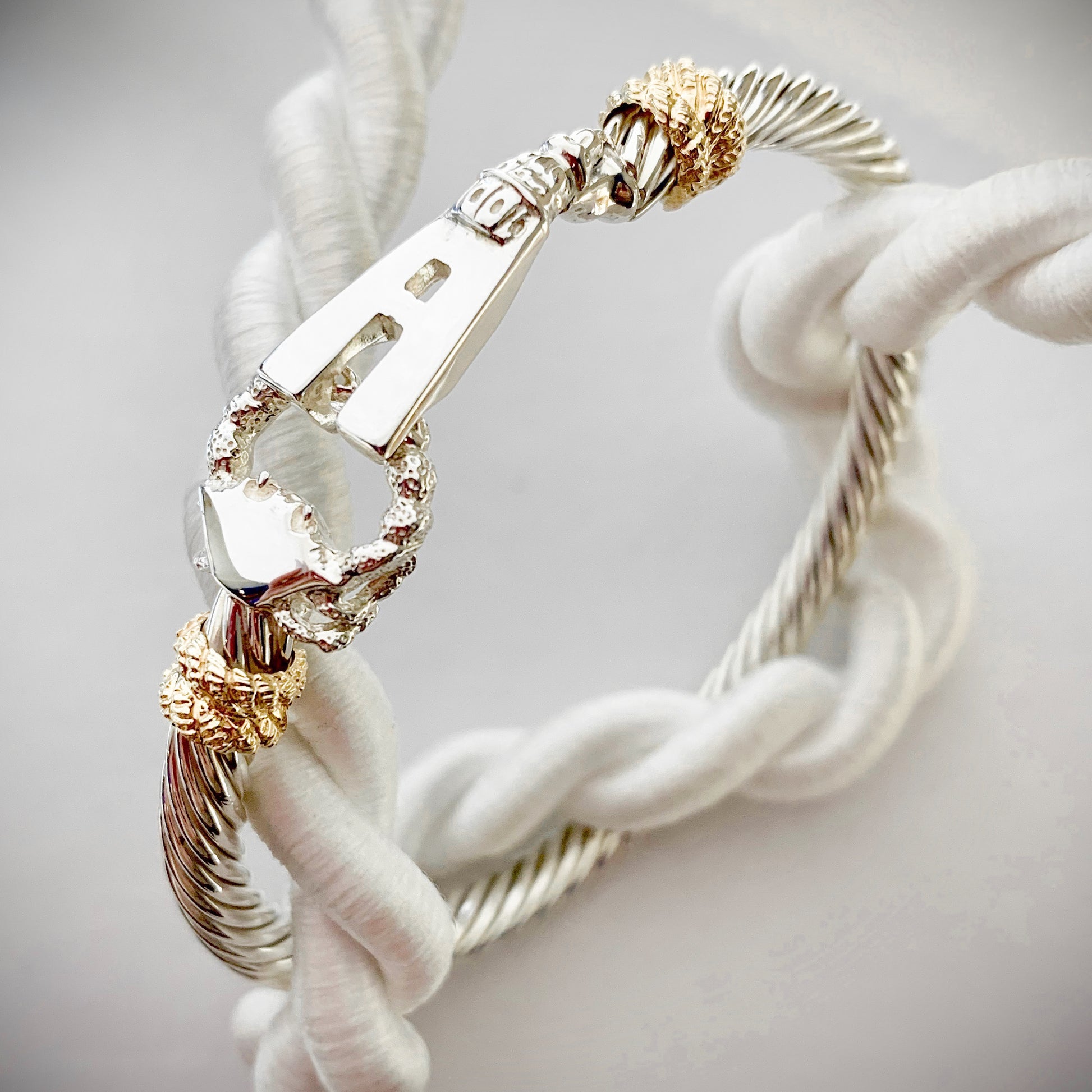 Annapolis Bracelet in sterling silver with 14kt yellow gold accents. The bracelet features a twisted rope band, Maryland crab, Maryland state house, and an "A" for Annapolis.