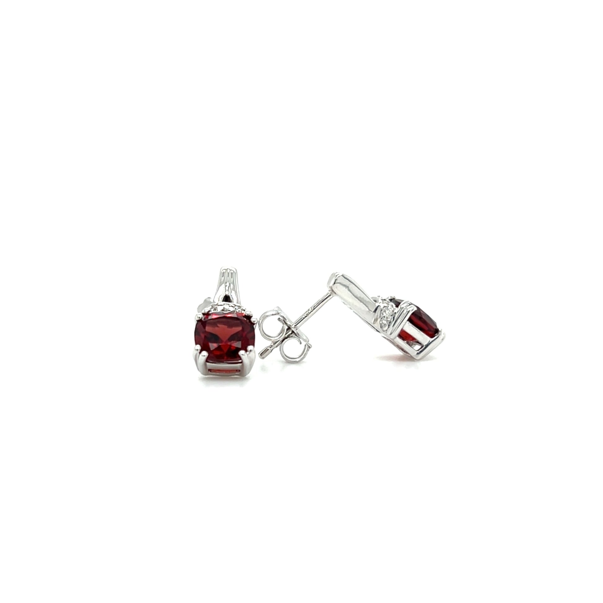 Cushion Garnet Post Earrings with Accent Diamonds in 10K White Gold. Front and Side View.