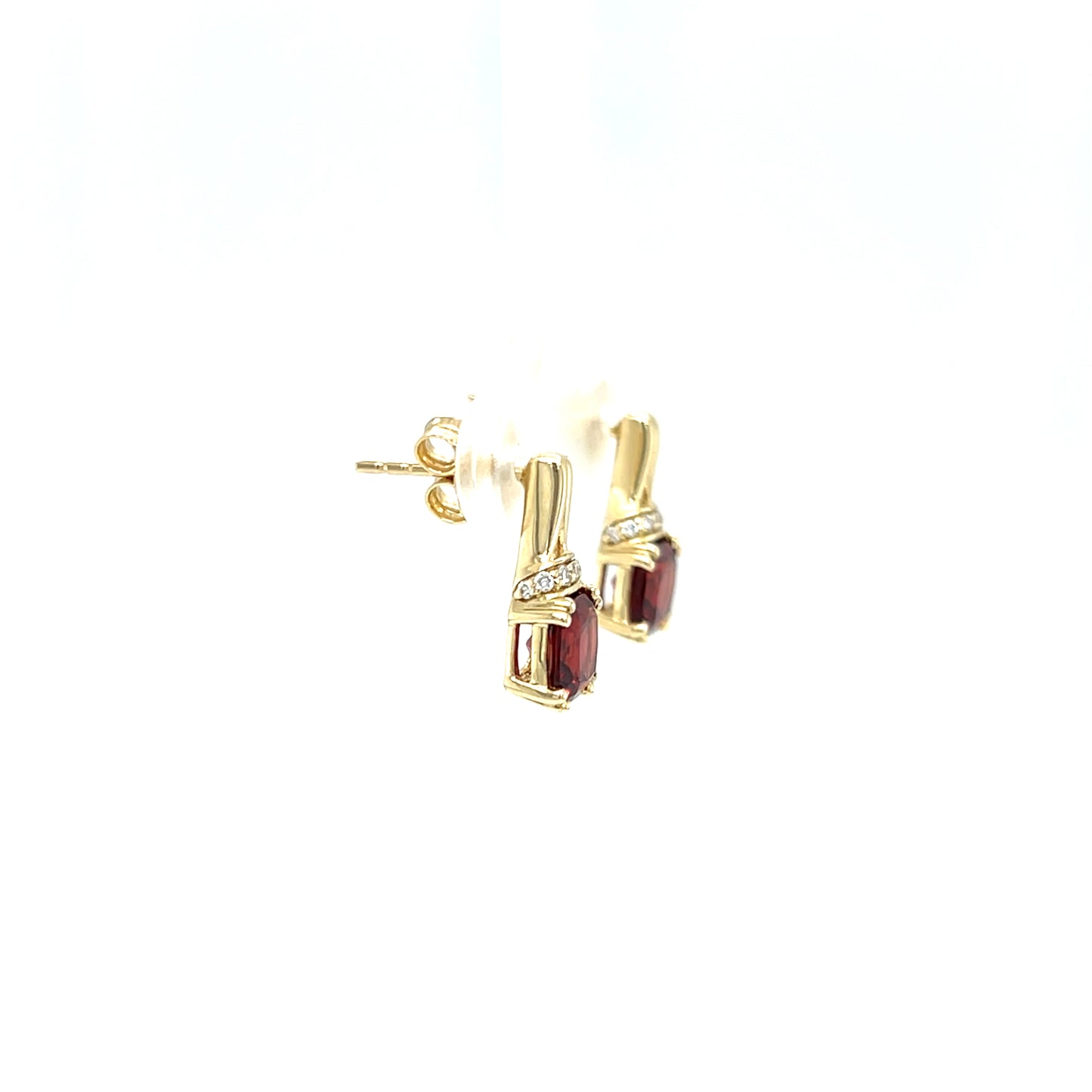 Cushion Garnet Post Earrings with Accent Diamonds in 10K Yellow Gold. Left Side View.
