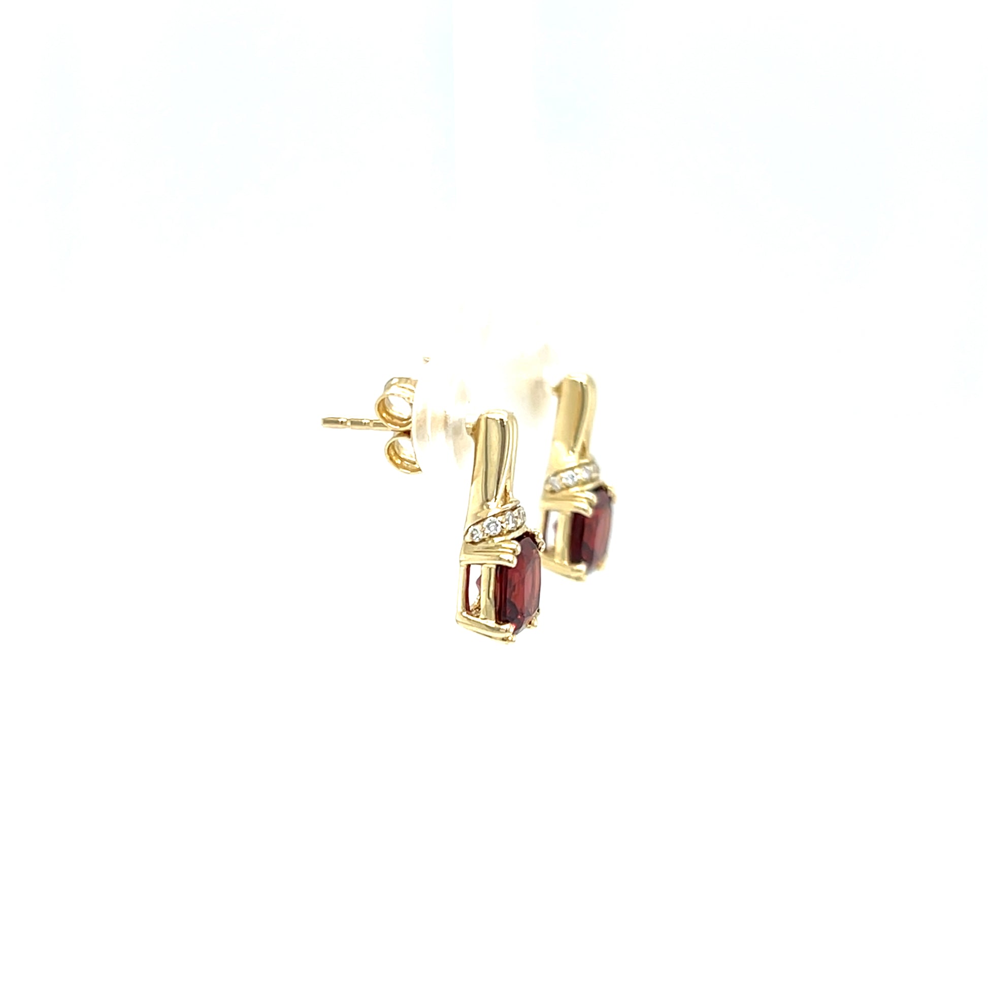 Cushion Garnet Post Earrings with Accent Diamonds in 10K Yellow Gold. Left Side View.