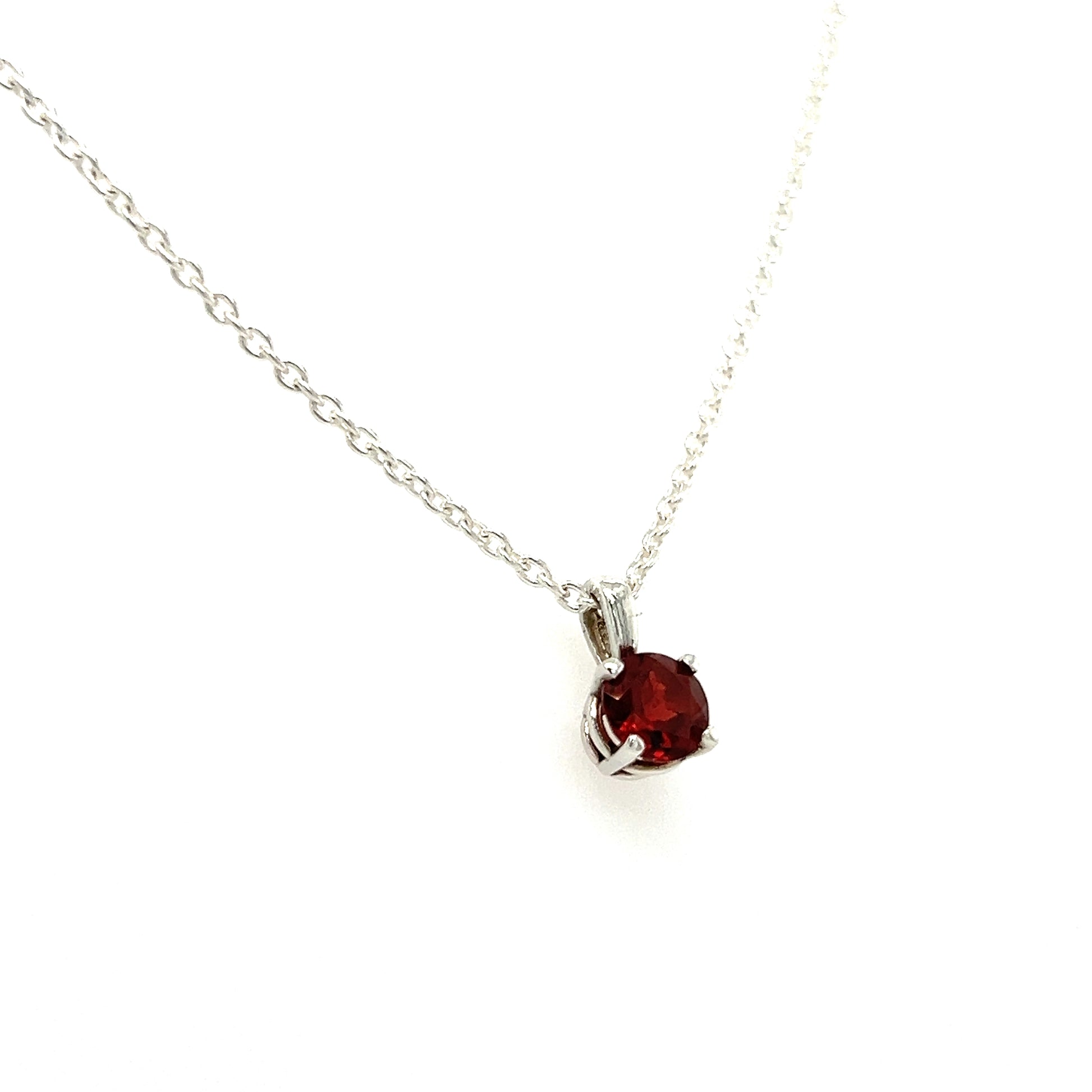 Round Garnet Necklace with 16in of Length in Sterling Silver. Left Side View.