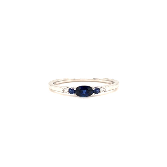 Oval Sapphire Ring with Two Side Sapphires and Diamonds in 18K White Gold Front View