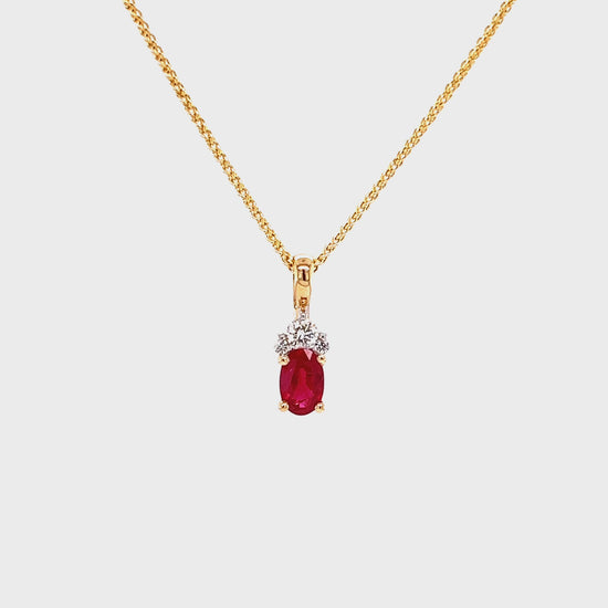 Oval Ruby Pendant with Three Accent Diamonds in 14K Yellow Gold Pendant and Chain Video