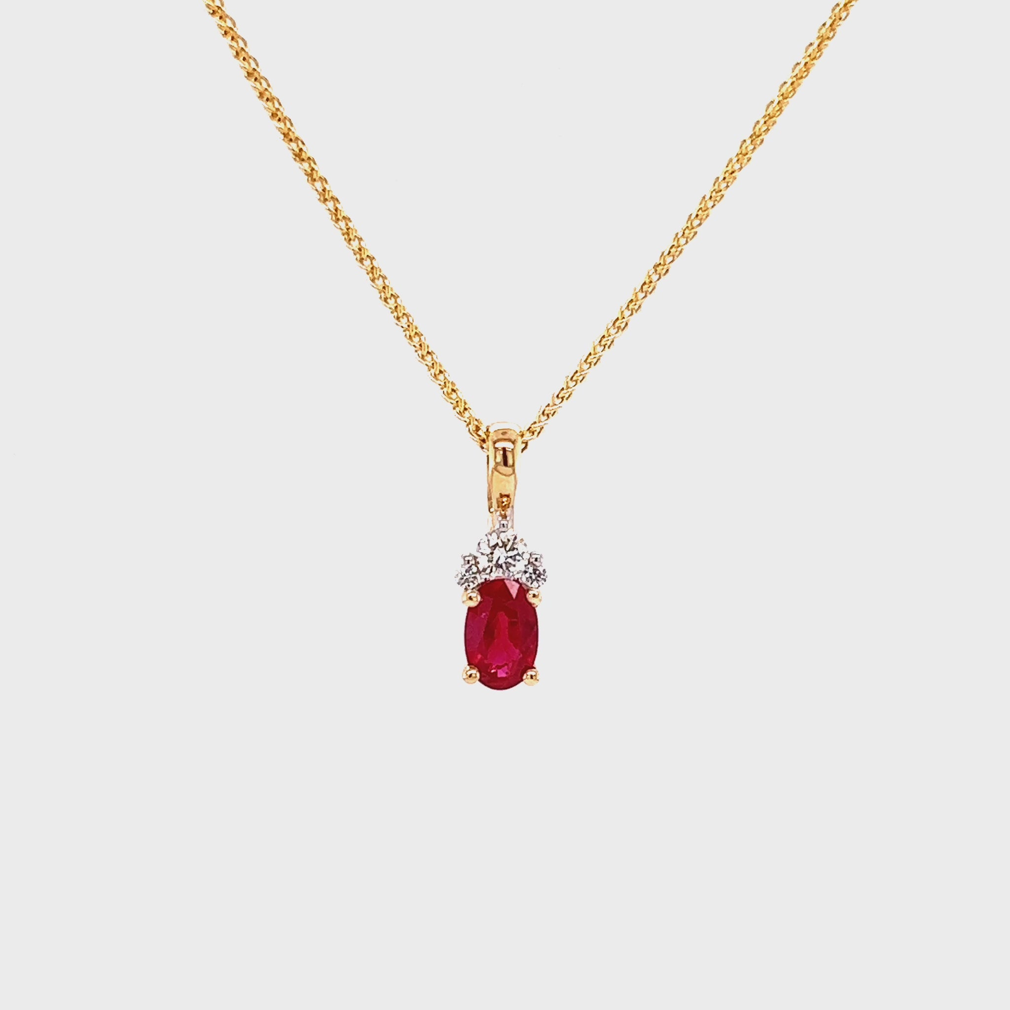 Oval Ruby Pendant with Three Accent Diamonds in 14K Yellow Gold Pendant and Chain Video