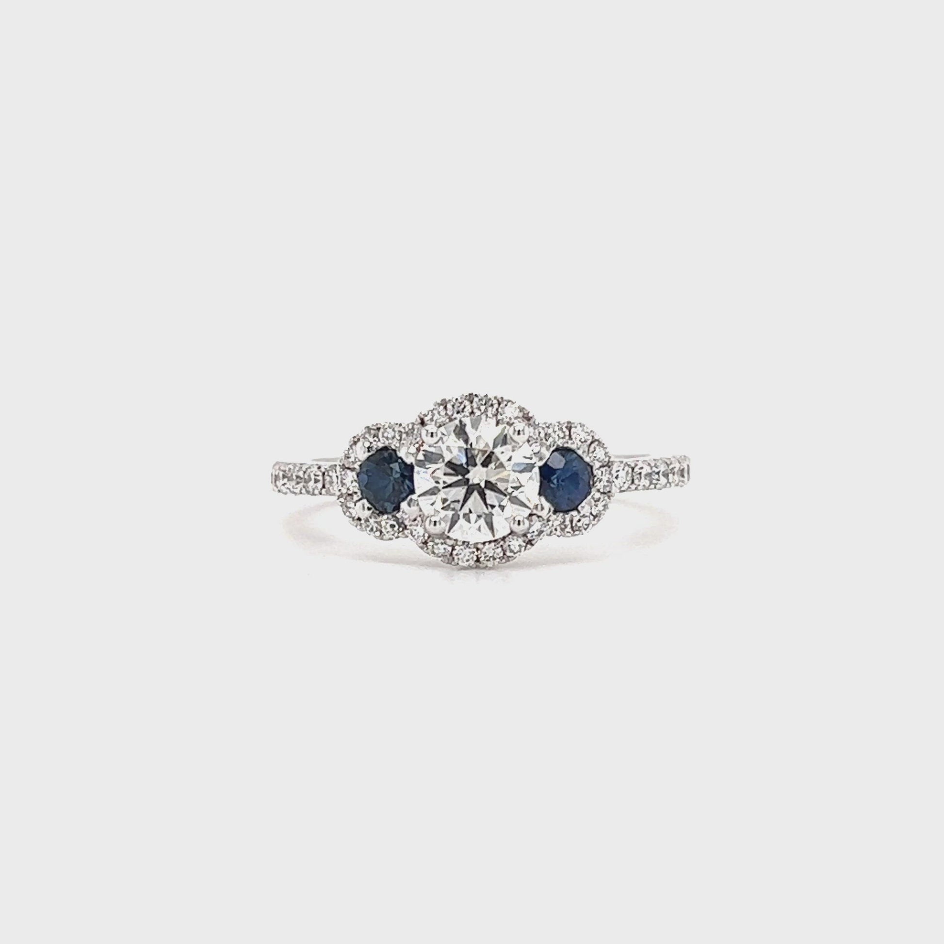 Round Diamond Ring with Two Side Sapphires and Diamond Halo in 14K White Gold Video