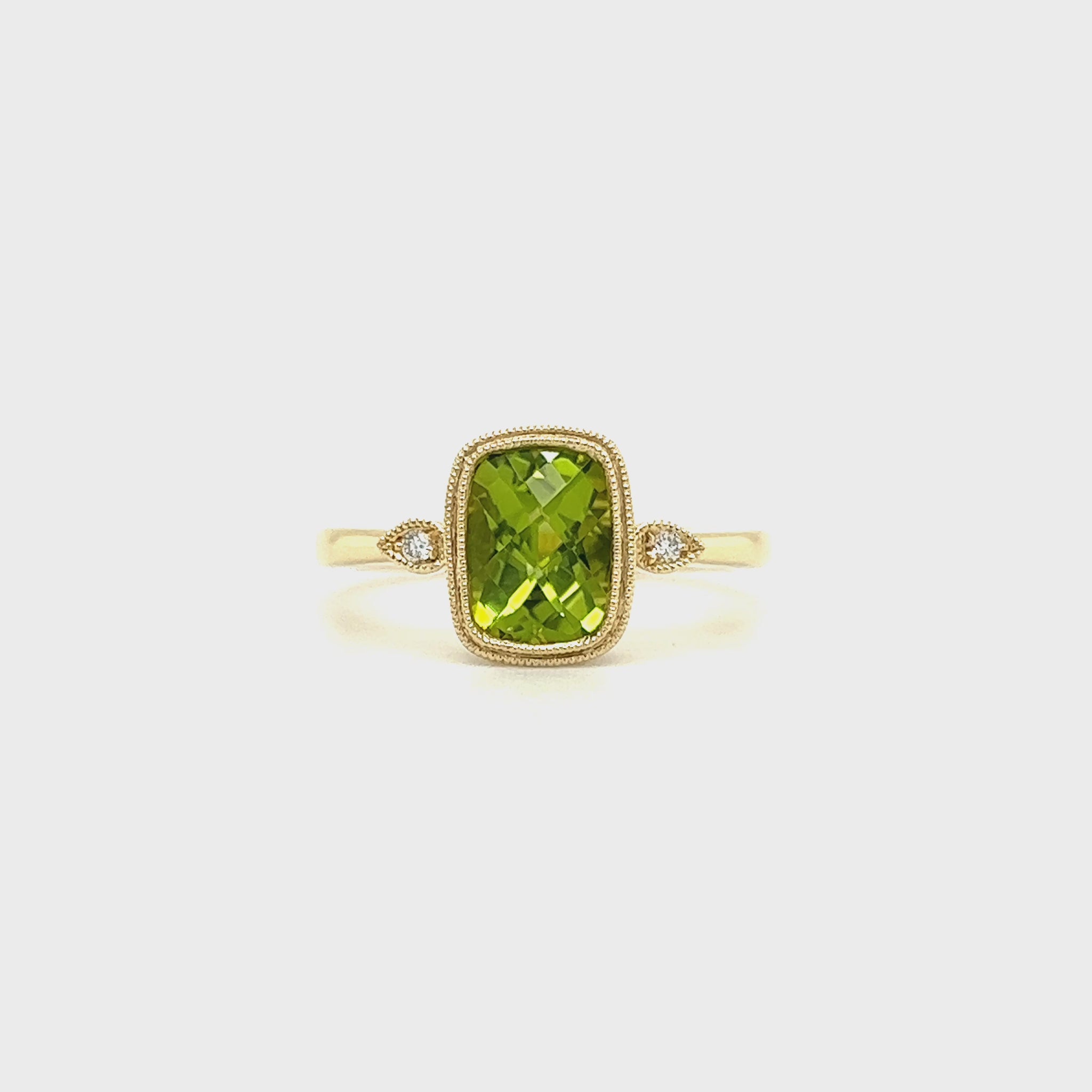 Cushion Peridot Ring with Two Side Diamonds in 14K Yellow Gold Video