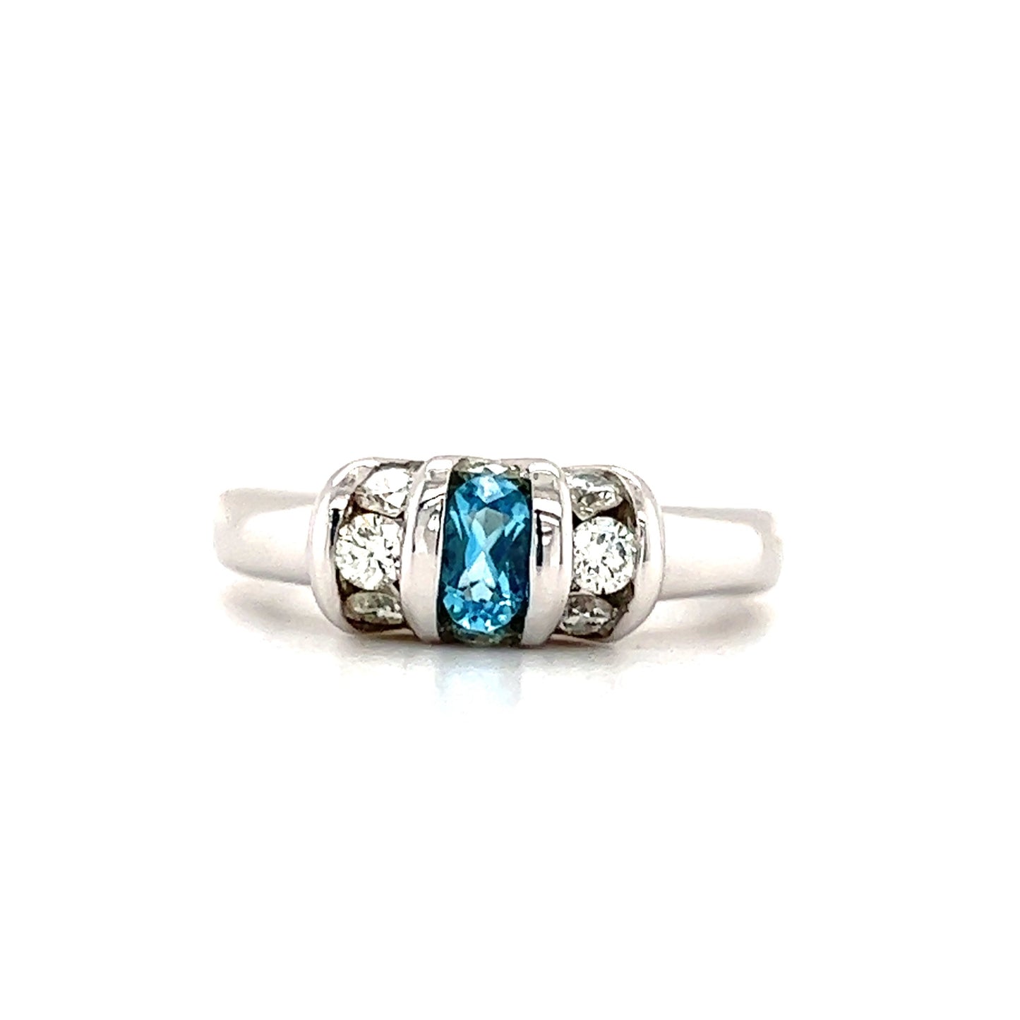 Oval Blue Topaz Ring with Side Diamonds in 14K White Gold Front View